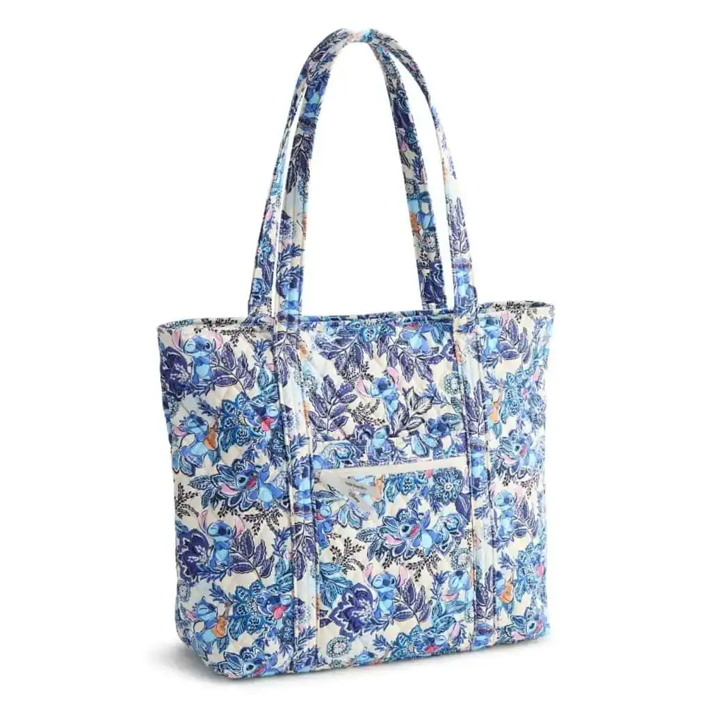 Light blue tote bag featuring Stitch and floral pattern, perfect for Disney and fashion lovers.