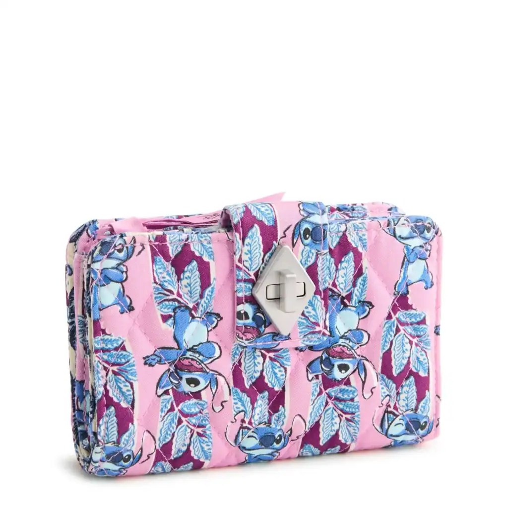 Bright pink Disney clutch featuring Stitch and floral motif, ideal for Disney-themed accessories.