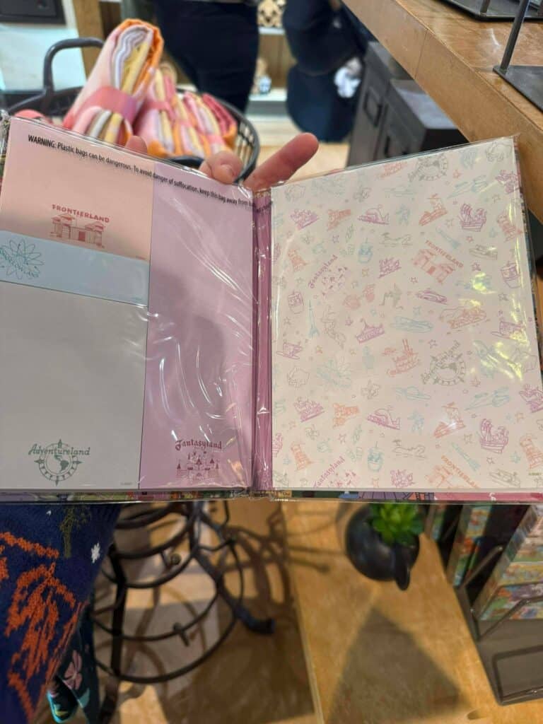 Disney sticker album featuring iconic attractions and characters from Disneyland parks.