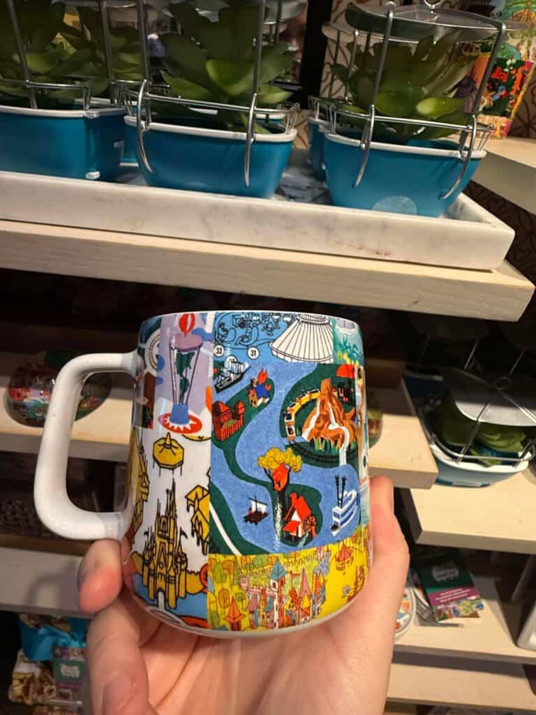 Vivid Disney-inspired mug featuring park attractions and fairy tale elements for Disney fans.