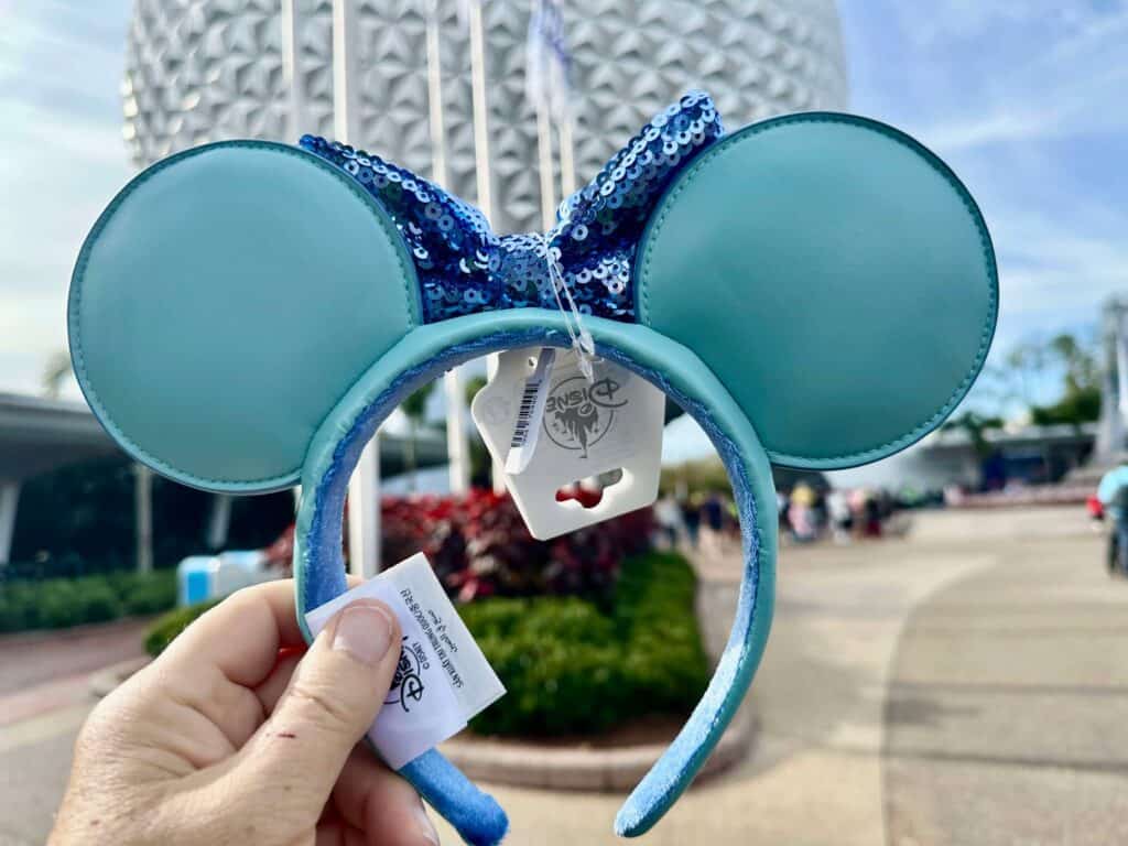 Stylish blue Mickey Mouse ears headband with sequined bow, ideal for Disney fans and park visits.