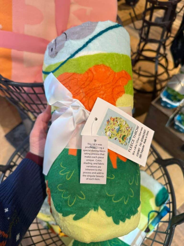 Soft Disney character fleece blanket with vibrant design, ideal for cozying up or gifting.