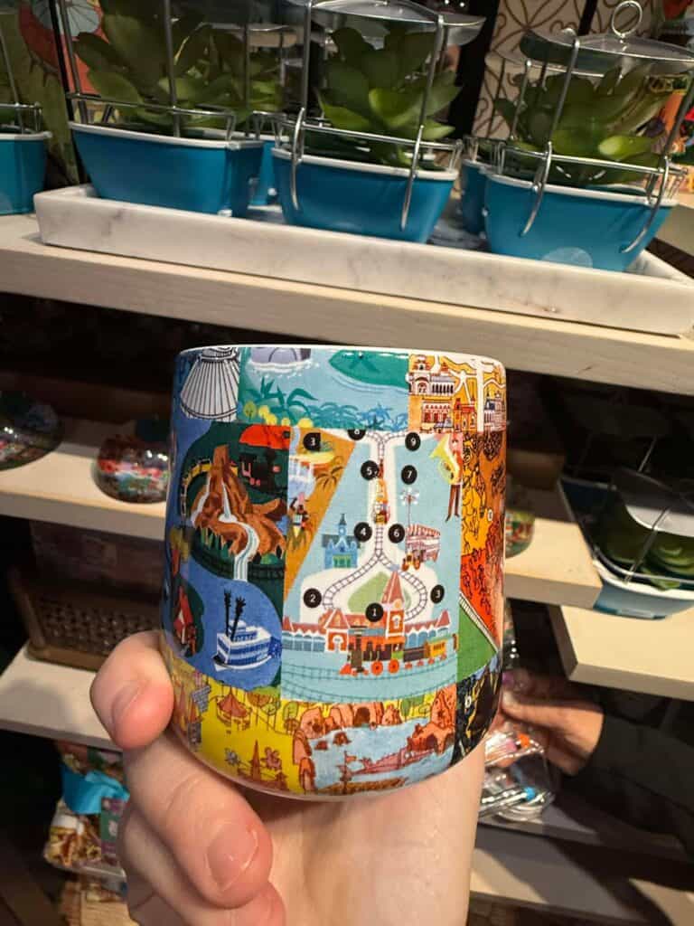 Vivid Disney park map candle holder showcasing various attractions and landmarks, perfect for Disney fans and collectors.