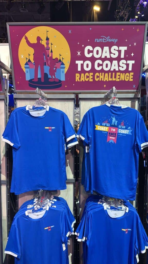 Disney Coast to Coast Race Challenge themed blue T-shirts featured on display.