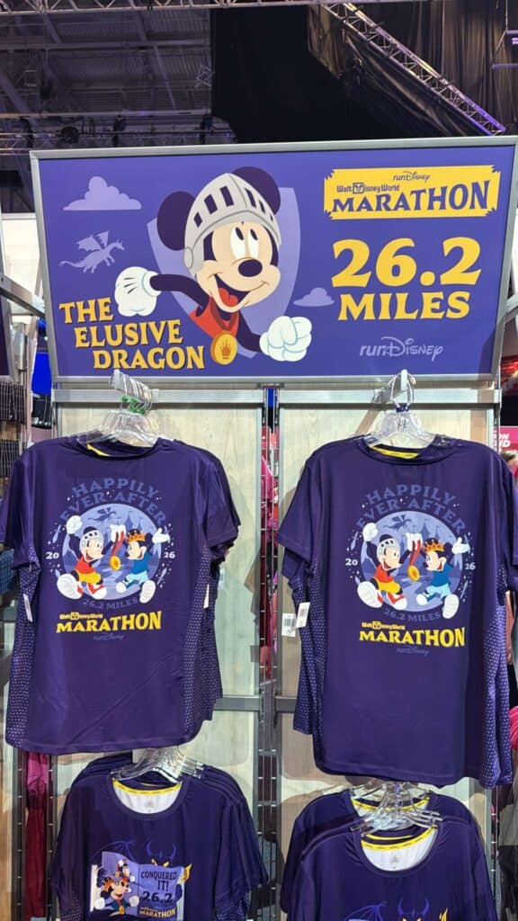 Decorative Disney Mickey Mouse "Happily Ever After" Marathon shirts displayed in retail store.