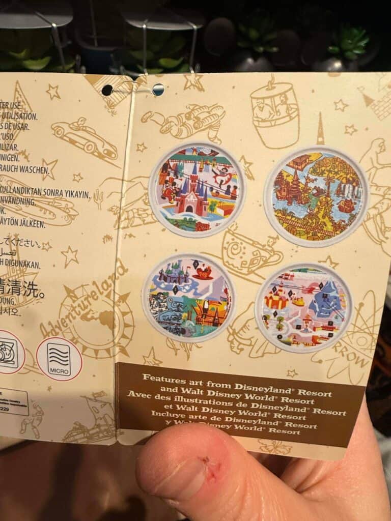 Colorful Disney theme park art pins.