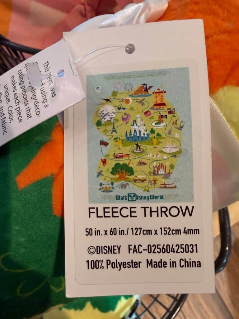 Colorful Disney-themed fleece throw with iconic park landmarks and characters. Perfect for fans and cozy comfort.