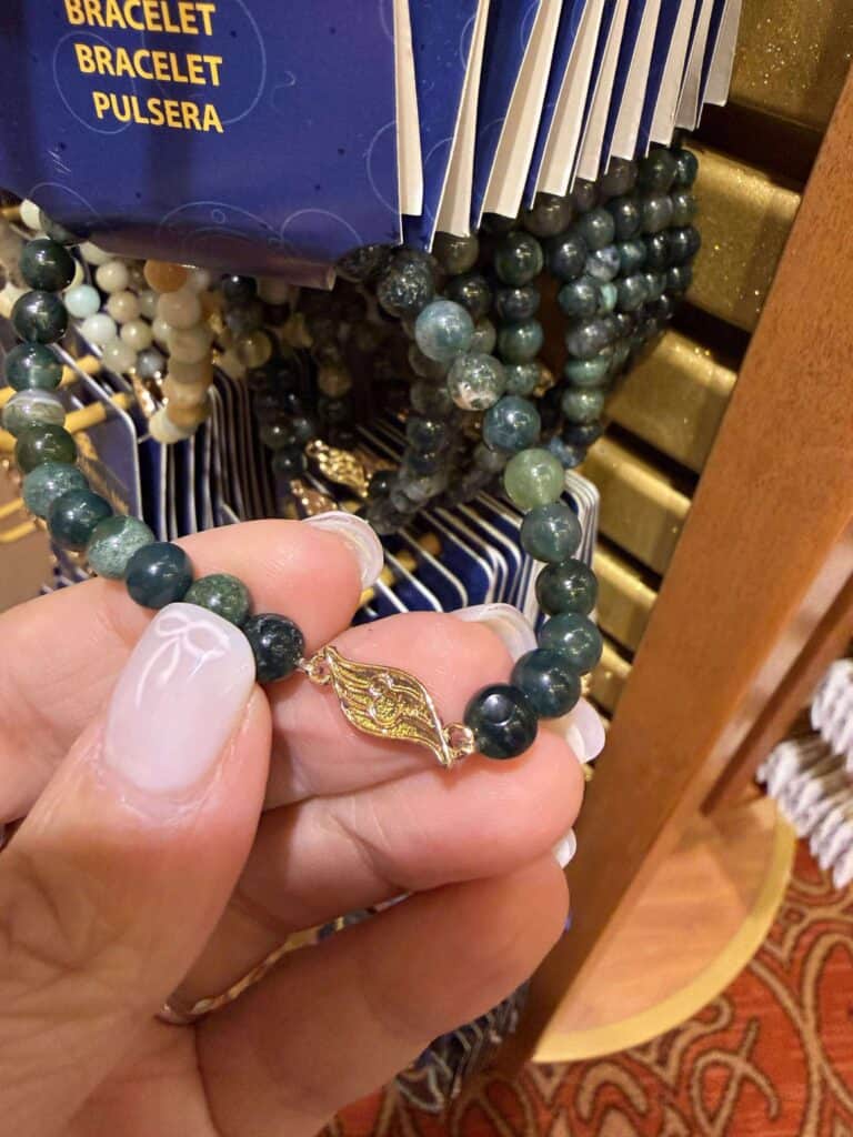 Elegant beaded bracelet with gold Hamsa charm, perfect for stylish accessories and jewelry collections.