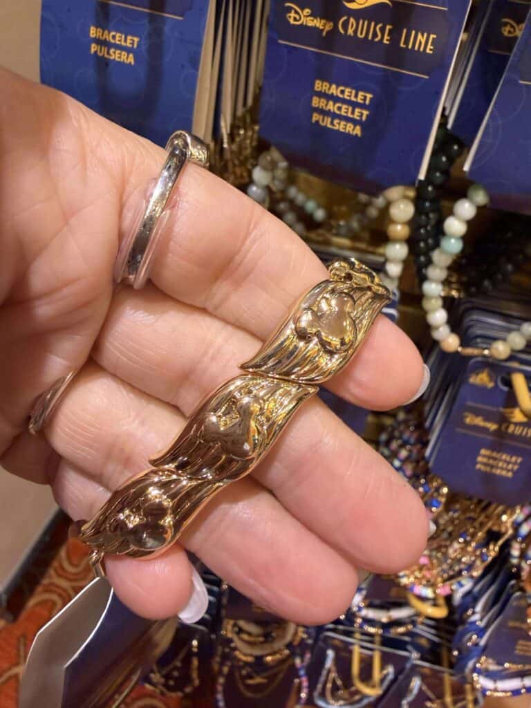 Beautiful gold and silver Mickey Mouse-themed bracelets at Disney merchandise shop.