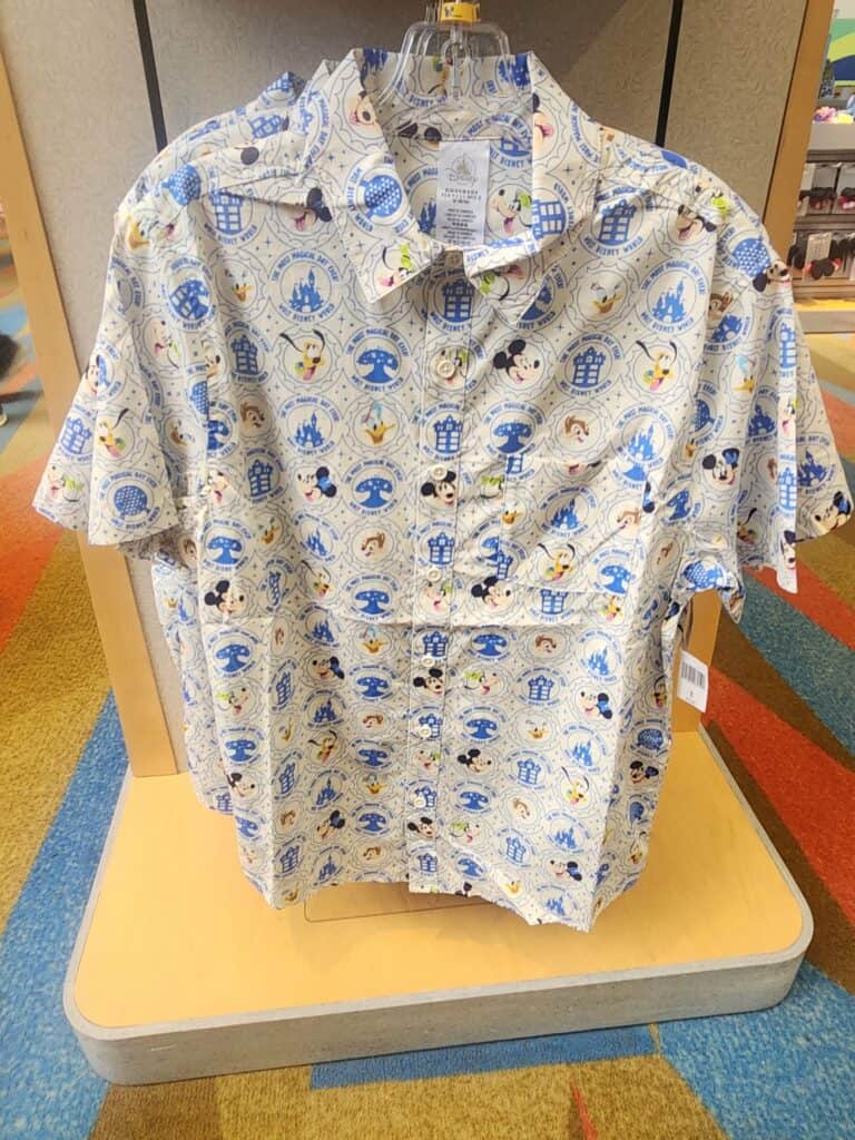 Colorful Disney Mickey Mouse themed short-sleeve shirt for adults. Perfect for Disney fans and casual wear.