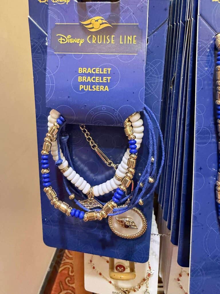 Colorful Disney Cruise Line-themed bracelet with blue, white, and gold beads.