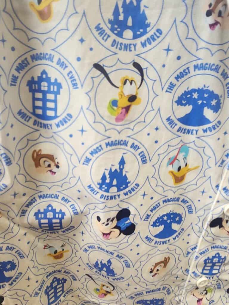 Colorful Disney characters and castle print for magical Disney-themed fashion.