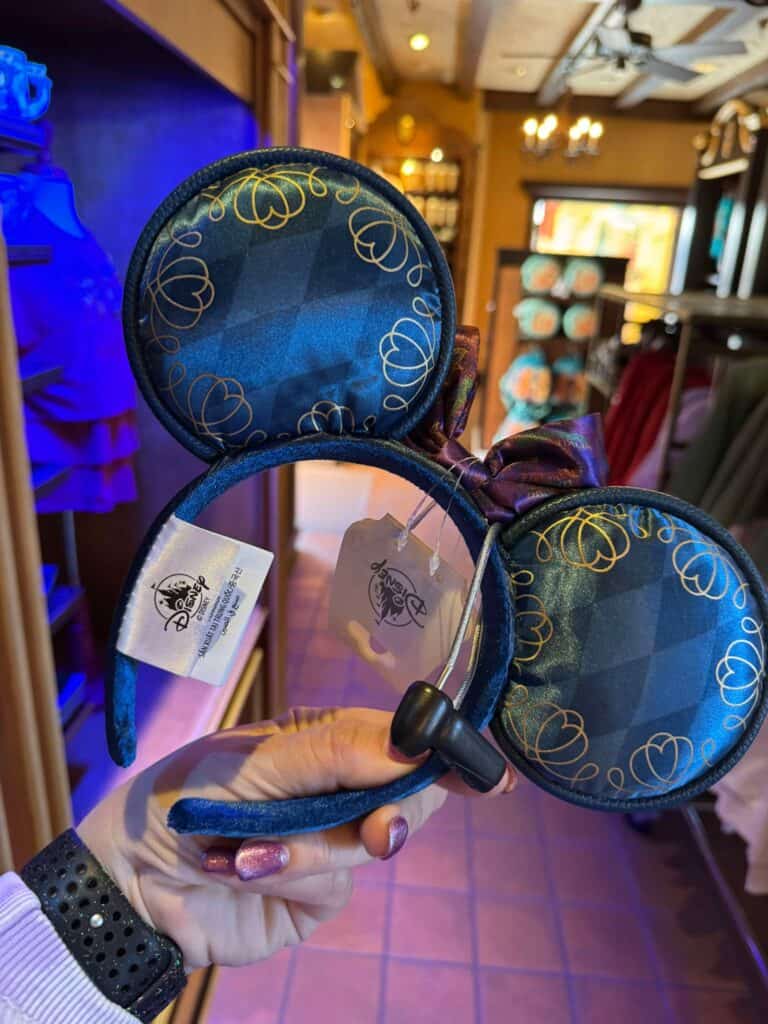 Disney Minnie Mouse ears headband, blue with gold swirl pattern, fun Disney fashion accessory.