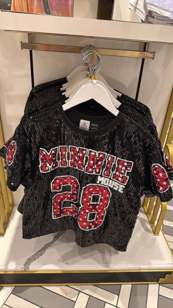 Sequin Minnie Mouse shirt with bold red and black design, perfect for Disney fashion lovers.