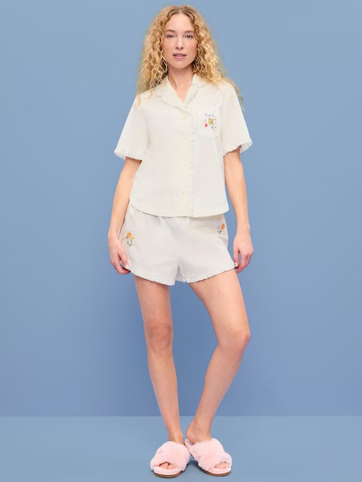 Comfortable cream Disney-themed pajama shirt and shorts for women, perfect for relaxing at home or sleeping.