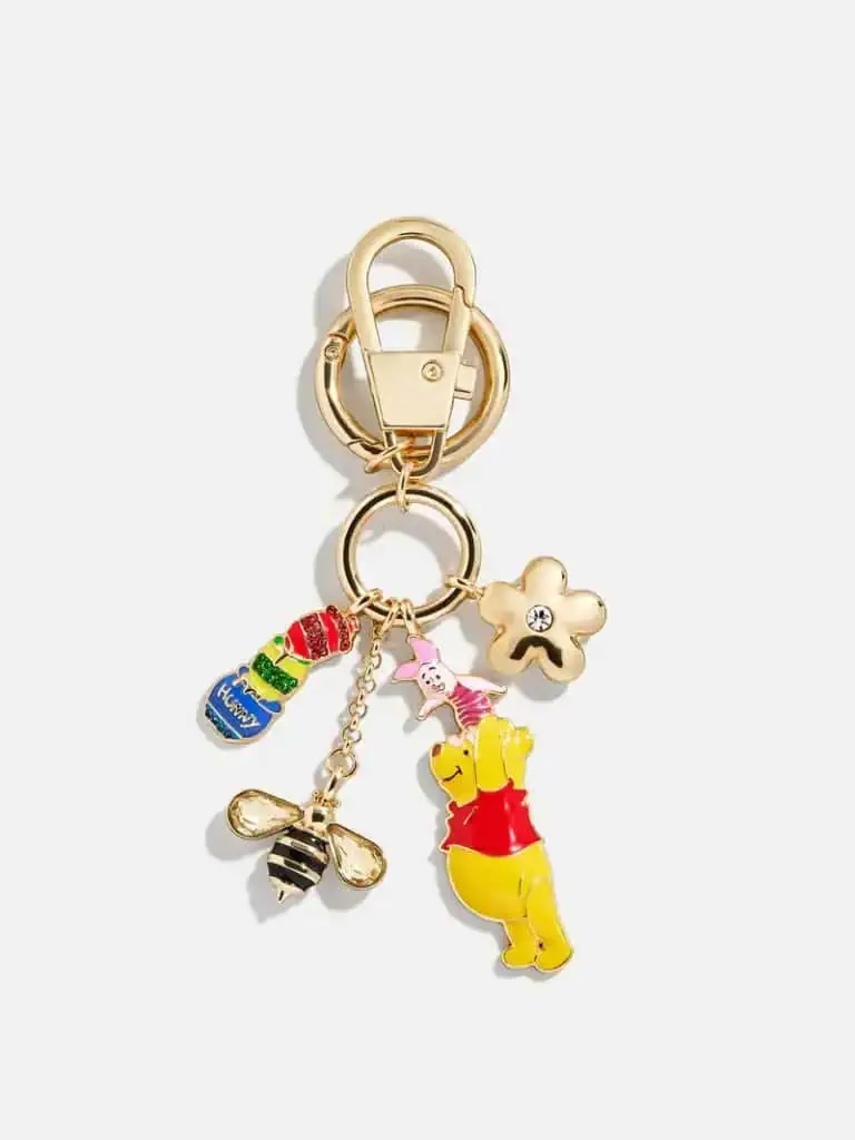 Disney Winnie the Pooh keychain with charms, colorful details, and Disney fashion accessories.