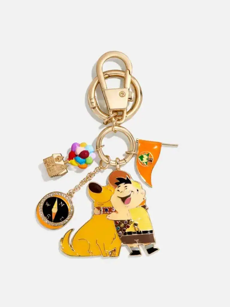 Cute Disney character keychain featuring Pooh and Tigger with charms, colorful beads, and a compass.