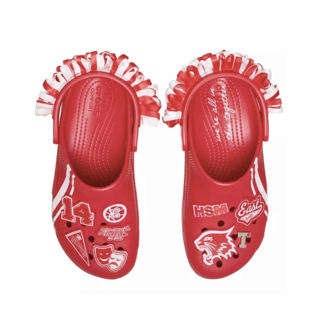 Colorful Disney-themed Crocs with racecar and theater graphics, perfect for fans and playful footwear lovers.