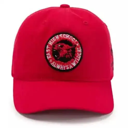 Red baseball cap with "High School Always A Dream" patch.