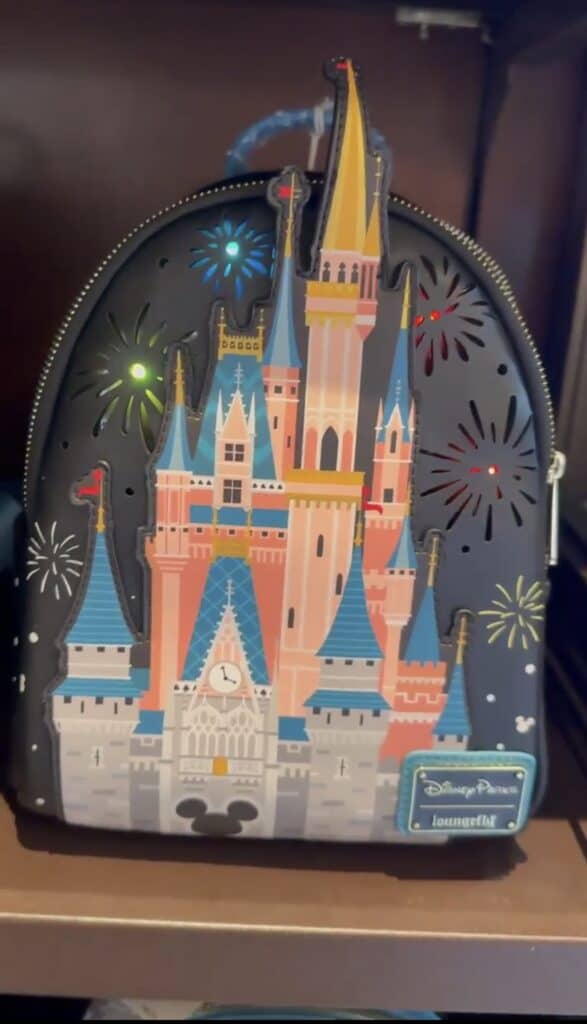 Magical Disney castle Loungefly backpack with fireworks detail.