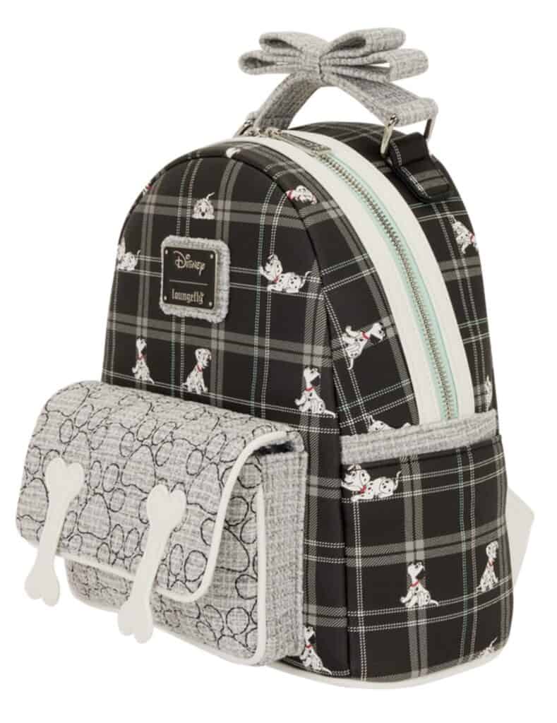 Cute Disney Dalmatian puppy print on black plaid backpack with front pocket and bone-shaped zipper pulls.