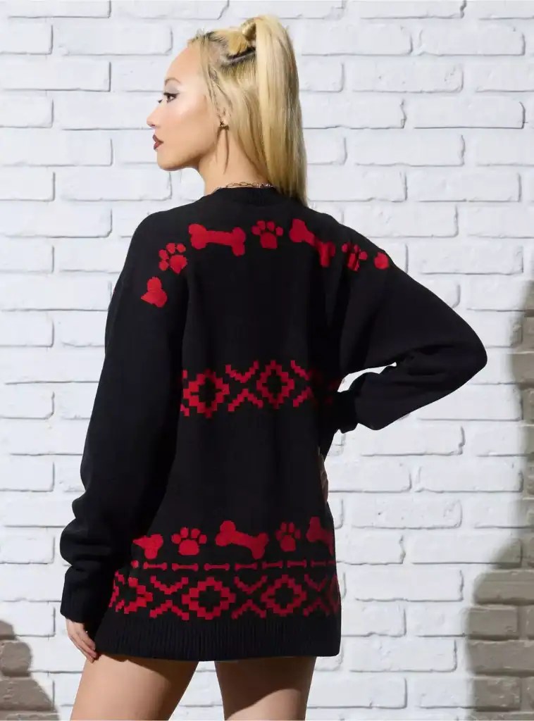 Cute Christmas sweater featuring red paws, hearts, and geometric designs for Disney fans.