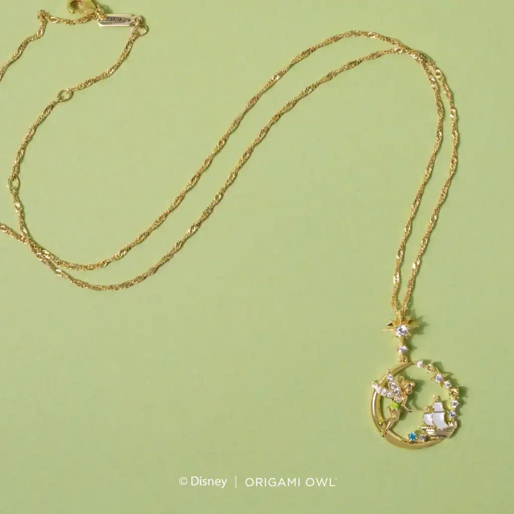 Gold Disney necklace featuring a star and fairy tale-themed charms, ideal for Disney jewelry lovers.