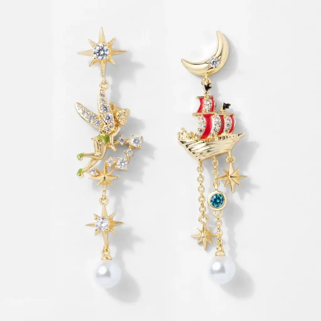 Sparkling Disney earrings with celestial and pirate ship motifs, adorned with crystals, pearls, and gold accents, ideal for Disney fashion lovers.