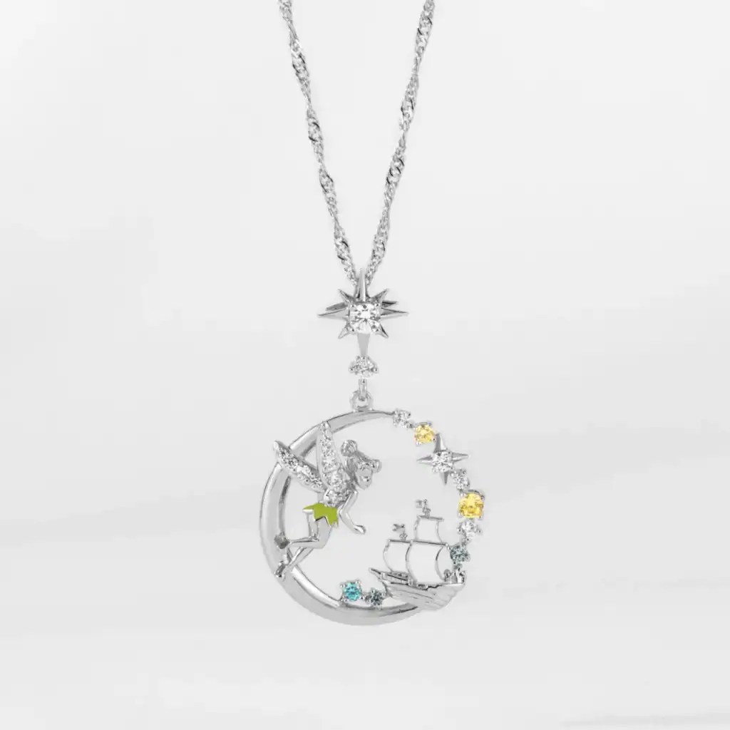 Beautiful sterling silver necklace featuring a moon, star, and ship with sparkling accents.