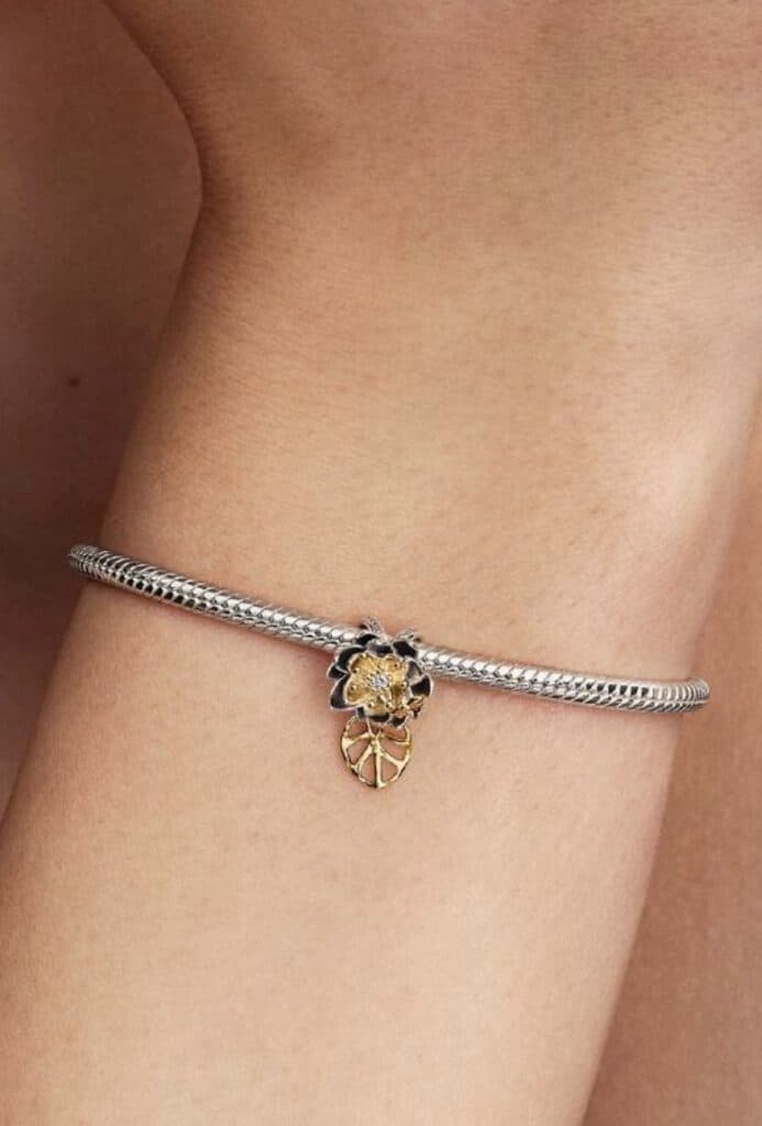 Silver bracelet with floral and leaf motif, perfect for Disney fashion lovers and jewelry enthusiasts.