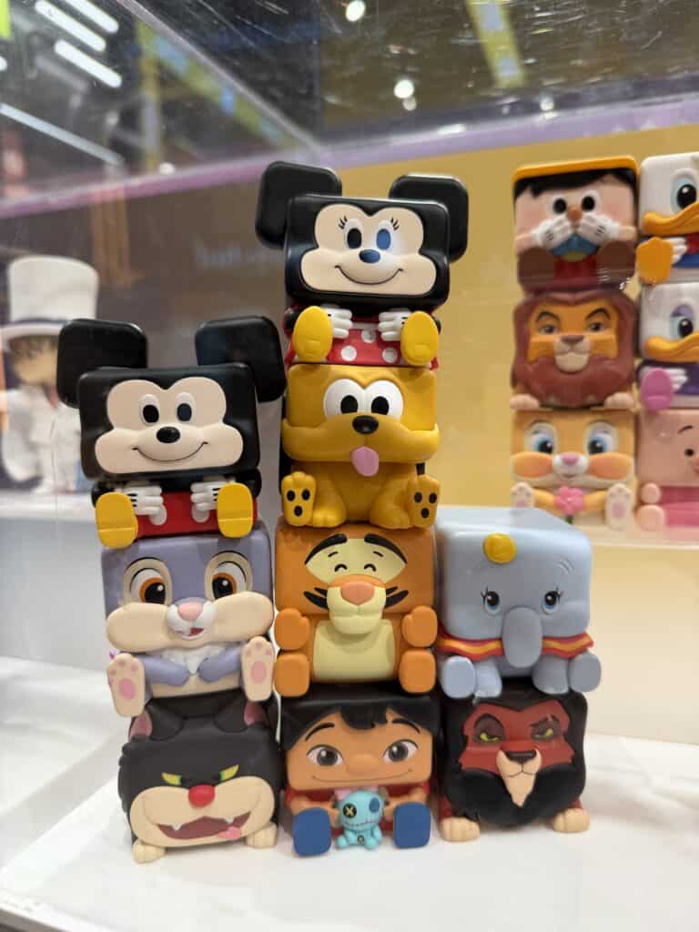 Disney plush and vinyl toys featuring Mickey, Minnie, Winnie the Pooh, Tigger, and more.