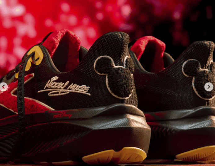 Cute black and red Mickey Mouse running shoes featuring embroidered Mickey faces and signature design.