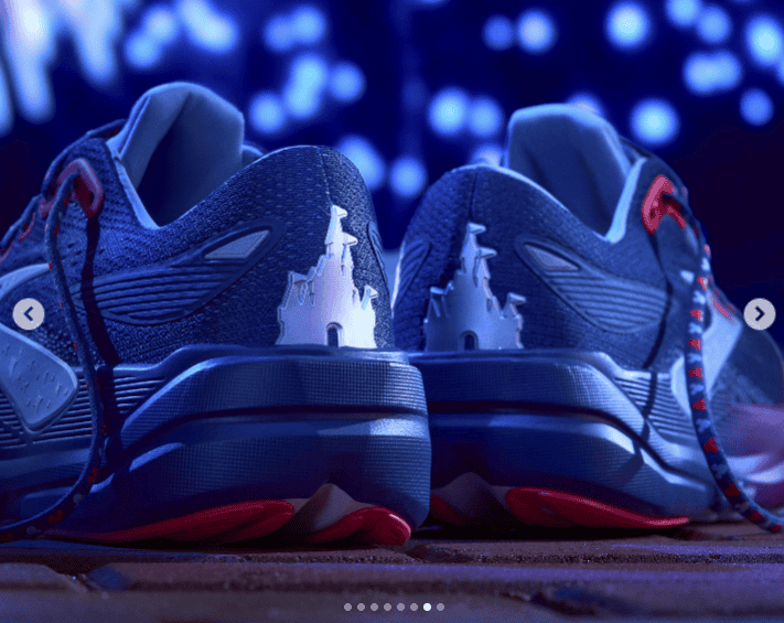 Athletic running shoes featuring Disney castle motifs, perfect for Disney-themed fashion enthusiasts.