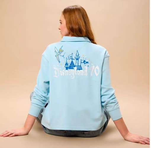 Cute Disneyland 70th anniversary hoodie featuring Sleeping Beauty castle and Tinker Bell. Perfect Disney fan fashion piece.