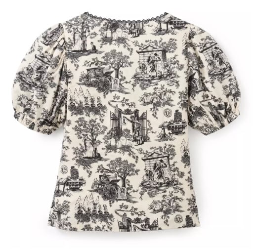 Detailed black and white toile de jouy-inspired designs of Parisian landmarks and scenes on a stylish dress.