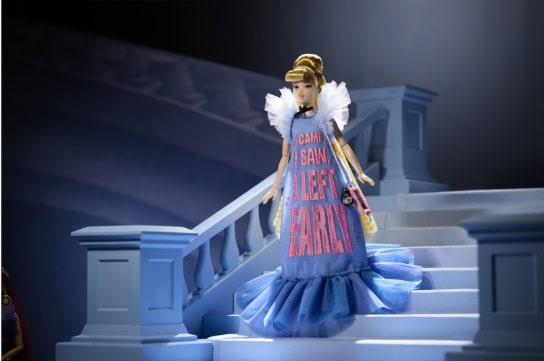Elegant Cinderella fashion doll on blue staircase with 'Came to Save the Day' dress.