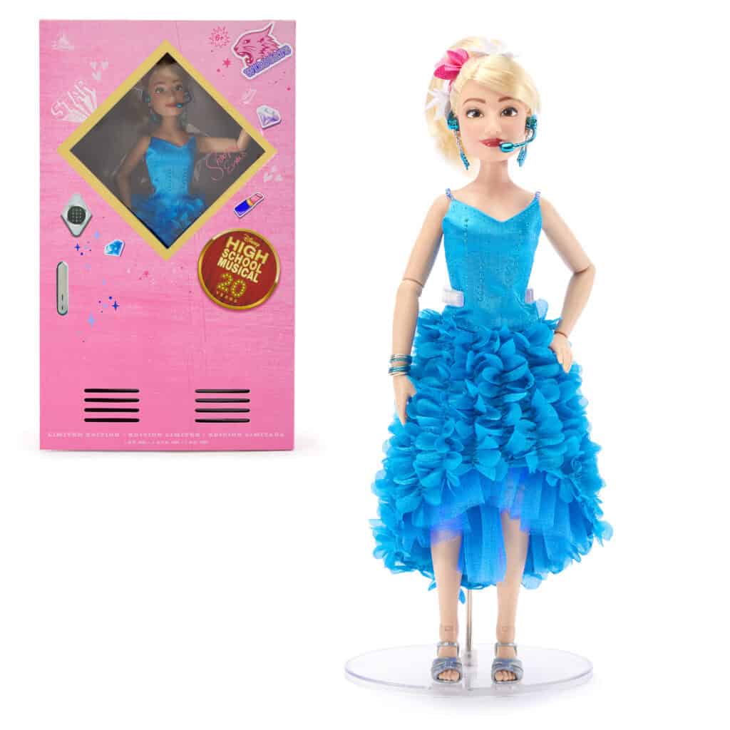 Detailed doll with blue dress, blonde hair, and headset, inspired by Disney’s High School Musical.