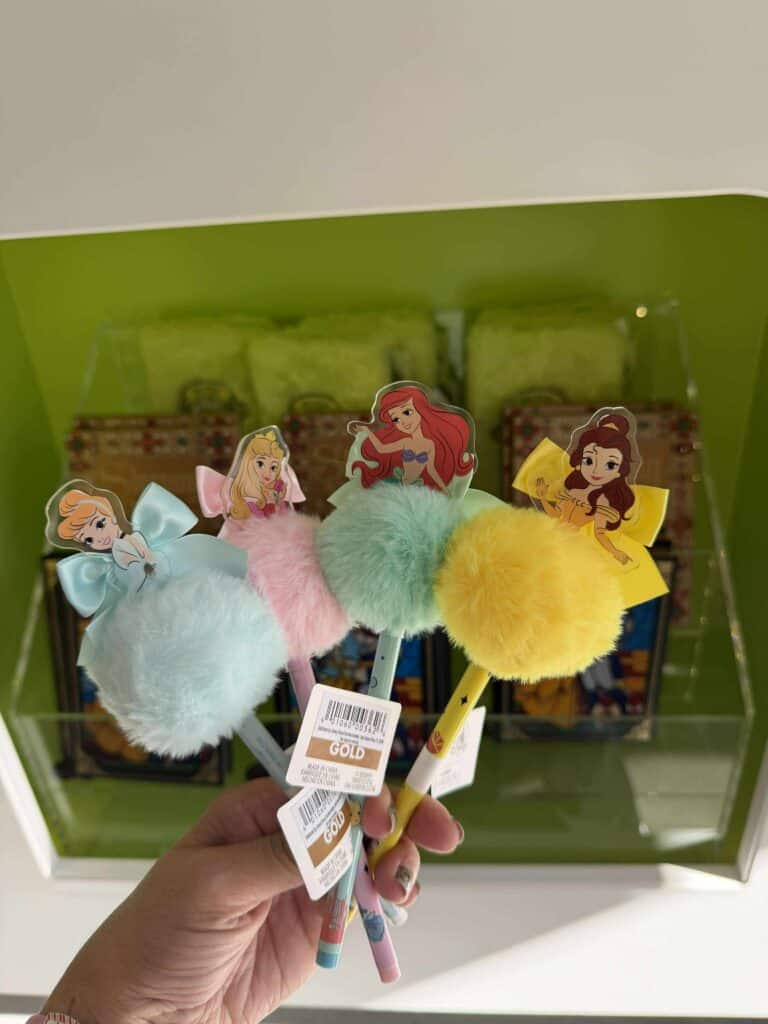 Colorful Disney princess plush pom-pom pens with character toppers from The Disney Fashionista collection.