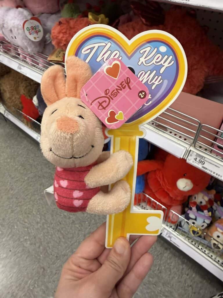 Cute Disney plush keychain featuring Winnie the Pooh.