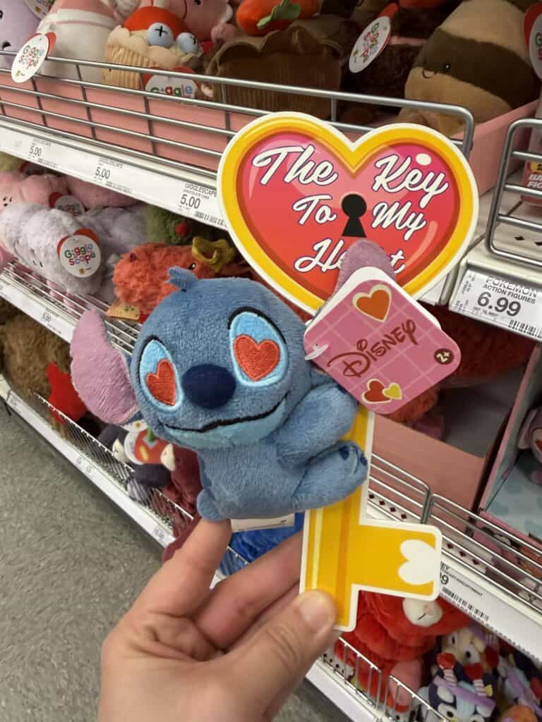 Disney Stitch plush keychain, heart-themed jewelry with romantic message and cute design.