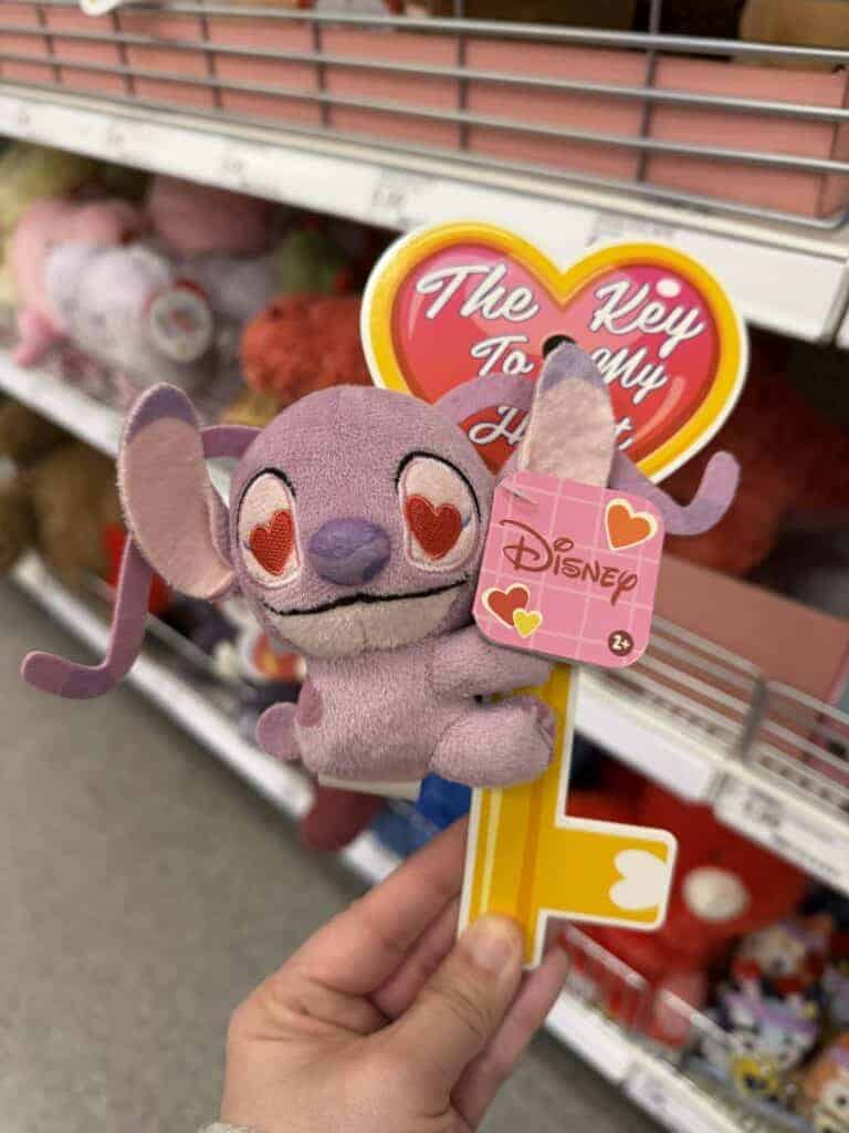 Adorable Disney Stitch plush keychain with heart-shaped eyes, ideal for Disney merchandise collectors.
