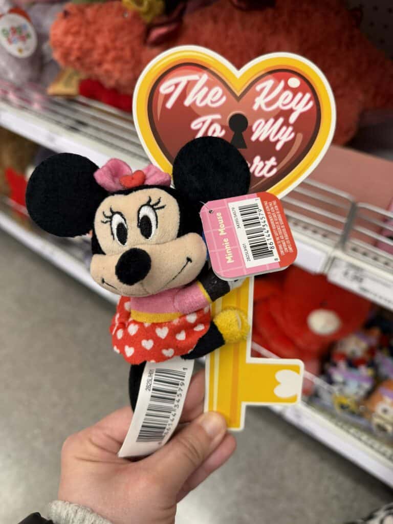 Adorable Minnie Mouse plush with pink bow and red dress, perfect for Valentine's Day gifts.