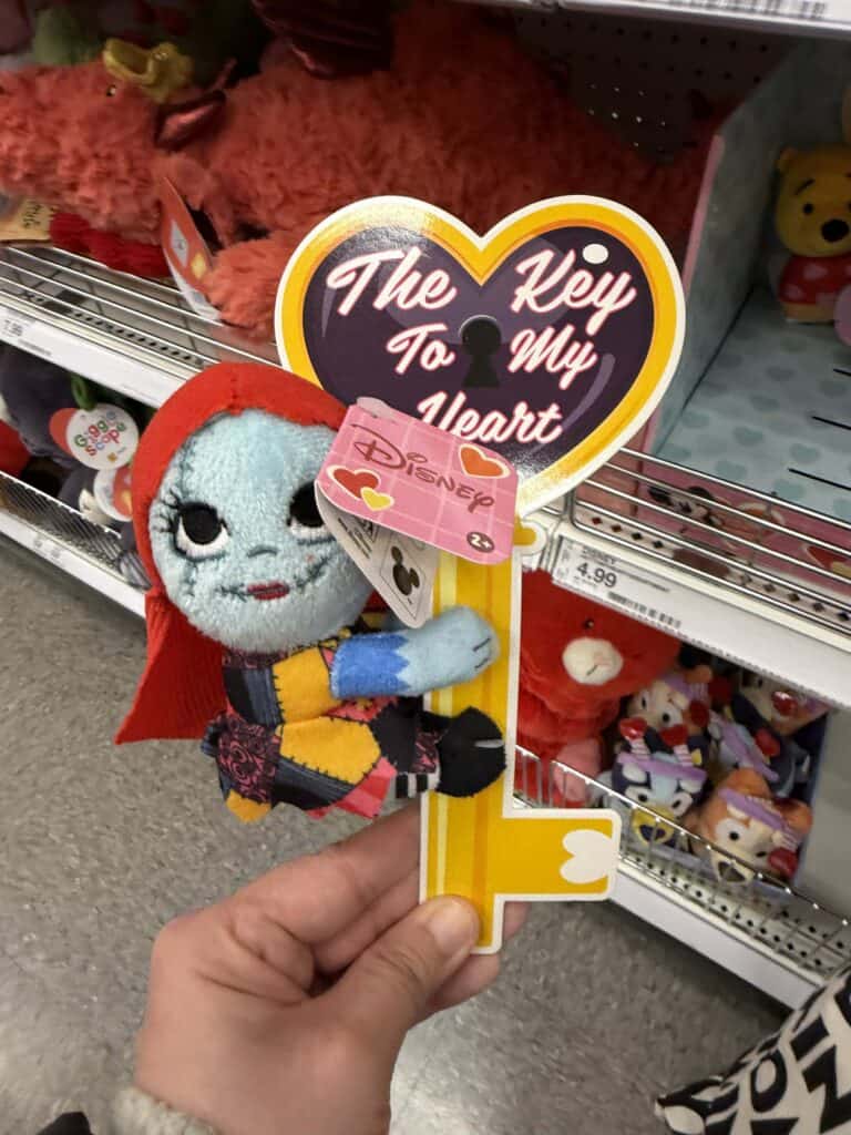 Disney plush toy with heart-shaped tag saying "The Key to My Heart".