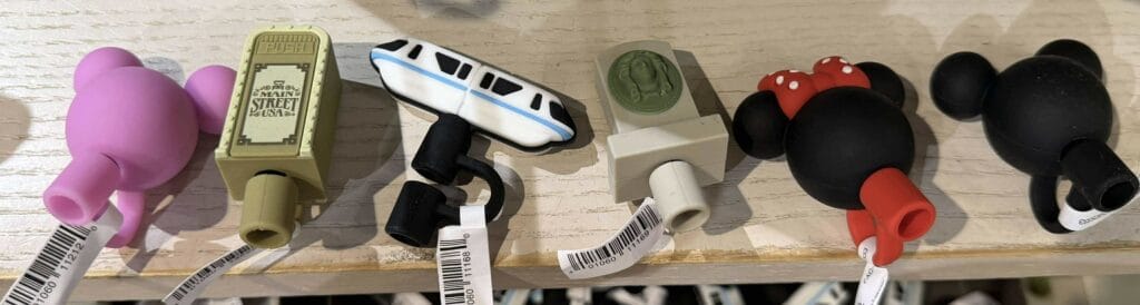 Colorful Disney-themed rubber stress toys and keychain characters.