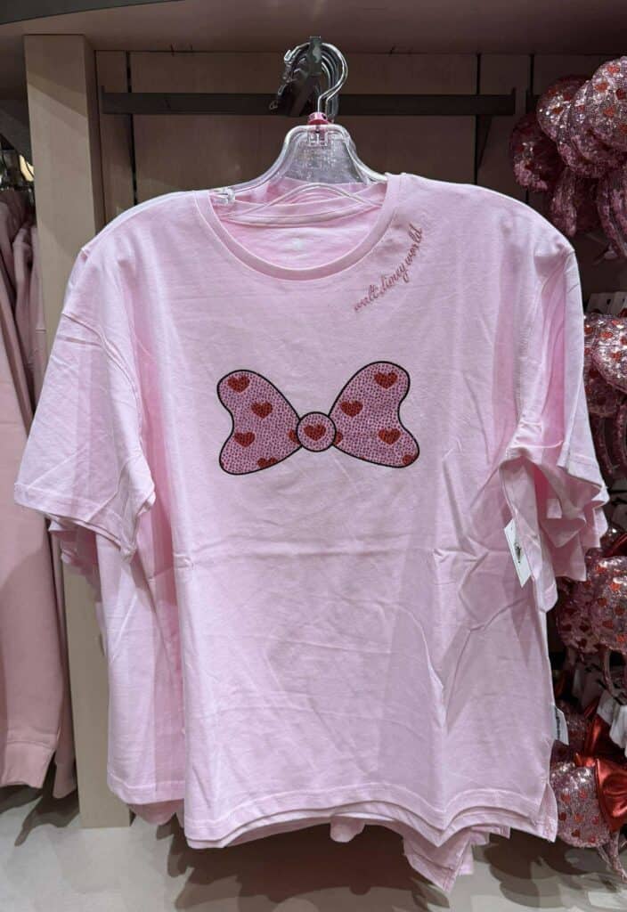 Pink Disney fashion T-shirt with heart butterfly graphic, perfect for Disney fans and casual wear.