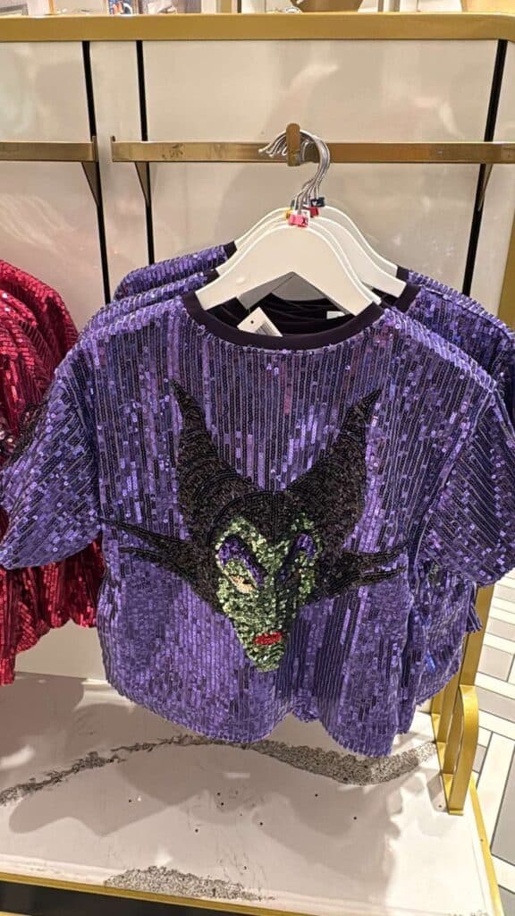 Sequined purple Maleficent T-shirt with villain face design, Disney inspired fashion piece.