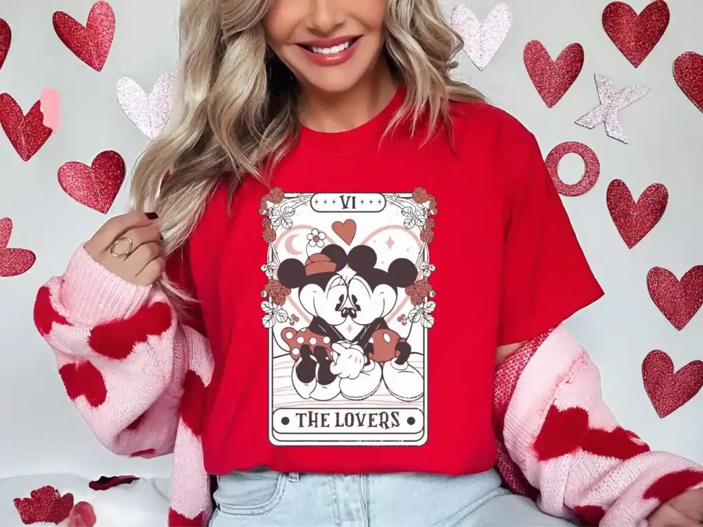 Adorable Disney themed Valentine's Day shirt with Mickey and Minnie as "The Lovers," ideal for Disney fans celebrating love.