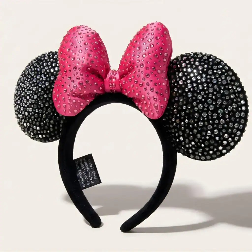 Pink and black rhinestone Minnie Mouse ears headband with bow, Disney fashion accessory.