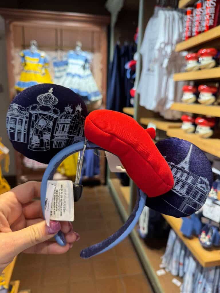 Disney Minnie Mouse ears headband with red bow, perfect for Disney fans.