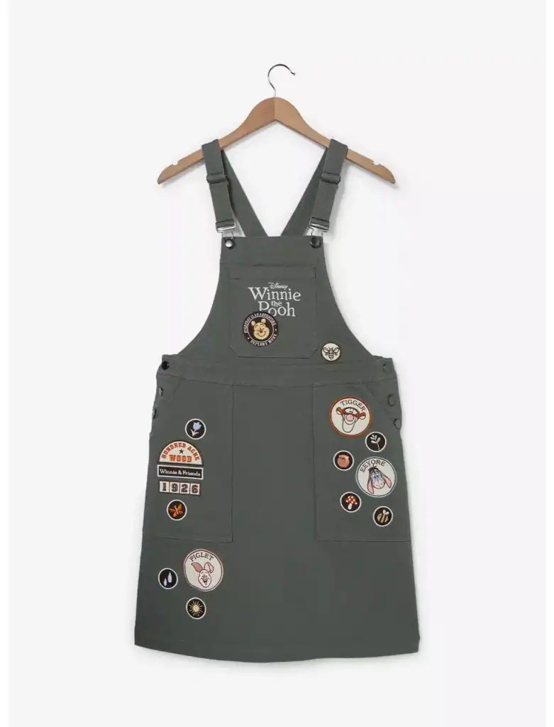 Grey Winnie the Pooh themed overalls with patches and embroidery.